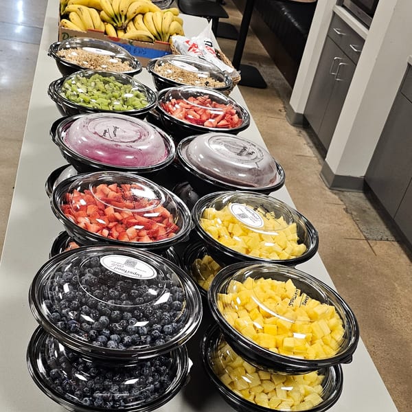 Superfood Cafe's healthy fruit and granola bowls, including blueberries, pineapple, strawberries, and kiwi.